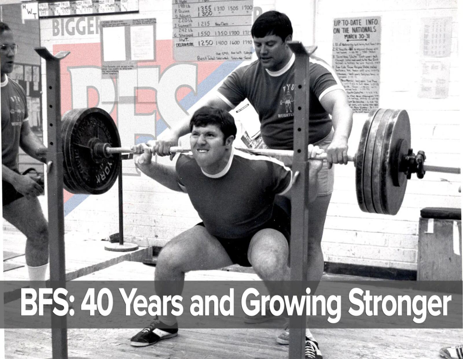 A 1970s squat session in the original BFS-era weight room, records chalked on the board behind